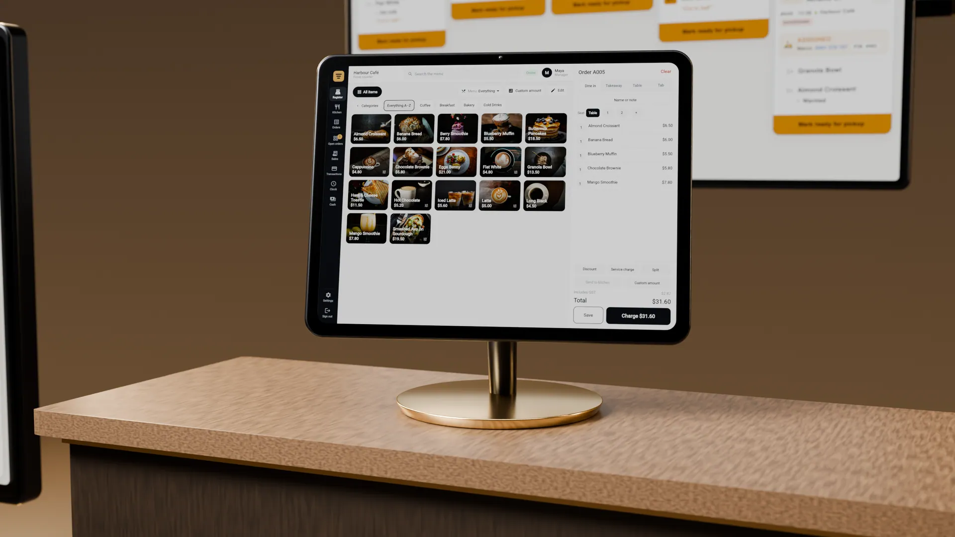 Servatto Register on its stand on a café counter, with the Kitchen display behind it.